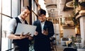 Two Businessman Working Together on Computer Laptop in Creative Workplace. Happy Business People Royalty Free Stock Photo