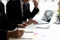 Two businessmen are analyzing earnings on a graph to plan investments Royalty Free Stock Photo