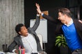 Two businessmen celebrate victory, goal reach, high five. Royalty Free Stock Photo