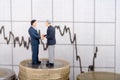Two businessmen on coins Royalty Free Stock Photo
