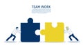 Two businessmen connect two puzzle pieces