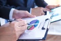 The two businessmen consulted about the operating results of the joint venture business, with statistical documentation