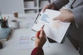 Two businessmen are discussing analyzing company financial papers, operating and marketing planning meetings for a growing and Royalty Free Stock Photo