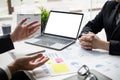 Two businessmen are discussing about earnings on a graph to plan investments Royalty Free Stock Photo