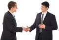 Two businessmen greet