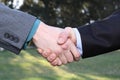 Two businessmen hands handshake