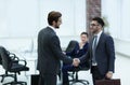 Two businessmen handshaking after striking grand deal Royalty Free Stock Photo