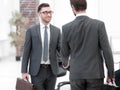 Two businessmen handshaking after striking grand deal Royalty Free Stock Photo