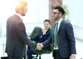 Two businessmen handshaking after striking grand deal Royalty Free Stock Photo