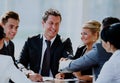 Two businessmen handshaking after striking grand deal. Royalty Free Stock Photo