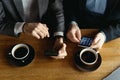 Two businessmen having a conversation using a smartphone Royalty Free Stock Photo