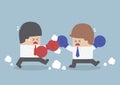 Two businessmen having a fight with boxing gloves