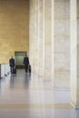 Two Businessmen Pulling Luggage In Airport Lobby