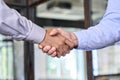 Two businessmen shake hands with business handshake concept.