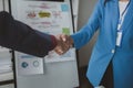 Two businessmen shake hands after a joint meeting, business venture handshake saluting, business meeting, presentation of business Royalty Free Stock Photo