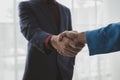 Two businessmen shake hands after a joint meeting, business venture handshake saluting, business meeting, presentation of business Royalty Free Stock Photo