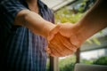 Two businessmen shaking hand after contract meeting