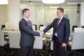 Two businessmen shaking hands in conference Royalty Free Stock Photo