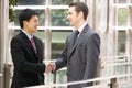 Two Businessmen Shaking Hands Outside Office Royalty Free Stock Photo