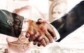 Two businessmen shaking hands after successful negotiations. The concept of trade and financial relations