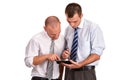 Two businessmen in shirts, looking down with confidence and cons Royalty Free Stock Photo