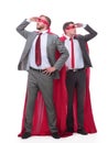 Two businessmen in superhero raincoats looking in different directions.