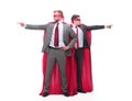 Two businessmen in superhero raincoats pointing in different directions.