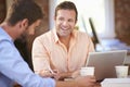 Two Businessmen Working At Desk Together Royalty Free Stock Photo