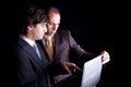 Two businessmen working together on a laptop Royalty Free Stock Photo