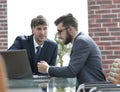 Two businessmen working together using laptop on business meeting in office Royalty Free Stock Photo