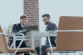 Two businessmen working together using laptop on business meeting in office Royalty Free Stock Photo