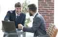 Two businessmen working together using laptop on business meeting in office Royalty Free Stock Photo