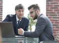 Two businessmen working together using laptop on business meeting in office Royalty Free Stock Photo