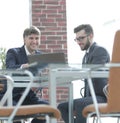 Two businessmen working together using laptop on business meeting in office Royalty Free Stock Photo