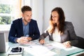 Two Businesspeople Analyzing Graph Royalty Free Stock Photo