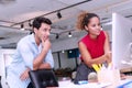 Businesspeople colleagues talking about planning project in the workplace. Woman pointing to computer man standing with