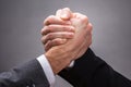 Two Businesspeople Competing In Arm Wrestling Royalty Free Stock Photo