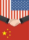 Two businesspeople handshake after good deal in front of an american and chinese flag. two flags face to face, symbol Royalty Free Stock Photo