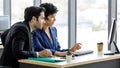 Two businesspeople, man and woman, working together with computer in office Royalty Free Stock Photo