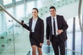 Businesspeople talking as they walk into the office Royalty Free Stock Photo