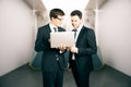Two businesspeople using laptop together Royalty Free Stock Photo