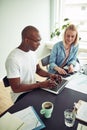 Two businesspeople working with a laptop in an office Royalty Free Stock Photo