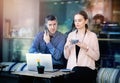 Two businesspeople working together in a local cafe. Businesspeople working together on a cafe terrace. Attractive businesswoman Royalty Free Stock Photo