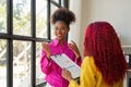 Two businesswoman African American working together talking about a business project. team of females executives meeting Royalty Free Stock Photo