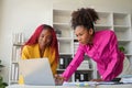 Two businesswoman African American working together using laptop and talking about a business project. team of females Royalty Free Stock Photo