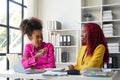 Two businesswoman African American working together using laptop and talking about a business project. team of females Royalty Free Stock Photo