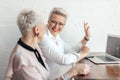 Two businesswoman using laptop in morning. Business, financial People and lifestyles Royalty Free Stock Photo