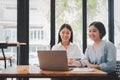 Two businesswoman working together on laptop computer Royalty Free Stock Photo