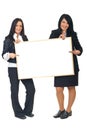 Two businesswomen with blank placard Royalty Free Stock Photo