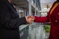 Two businesswomen, caucasian and african shaking hands, done deal concept Royalty Free Stock Photo